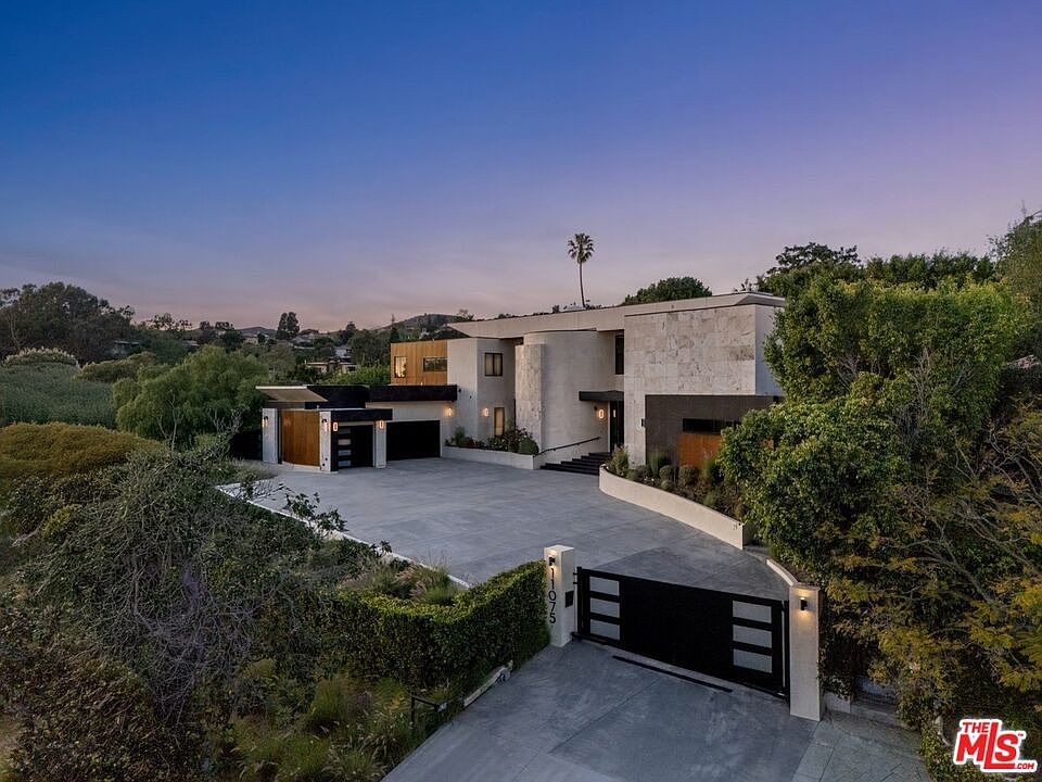 11075 W Sunset Blvd 2022 contemporary estate with floating staircase and disappearing glass walls